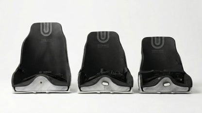 Three black standard testa-seats on a white background