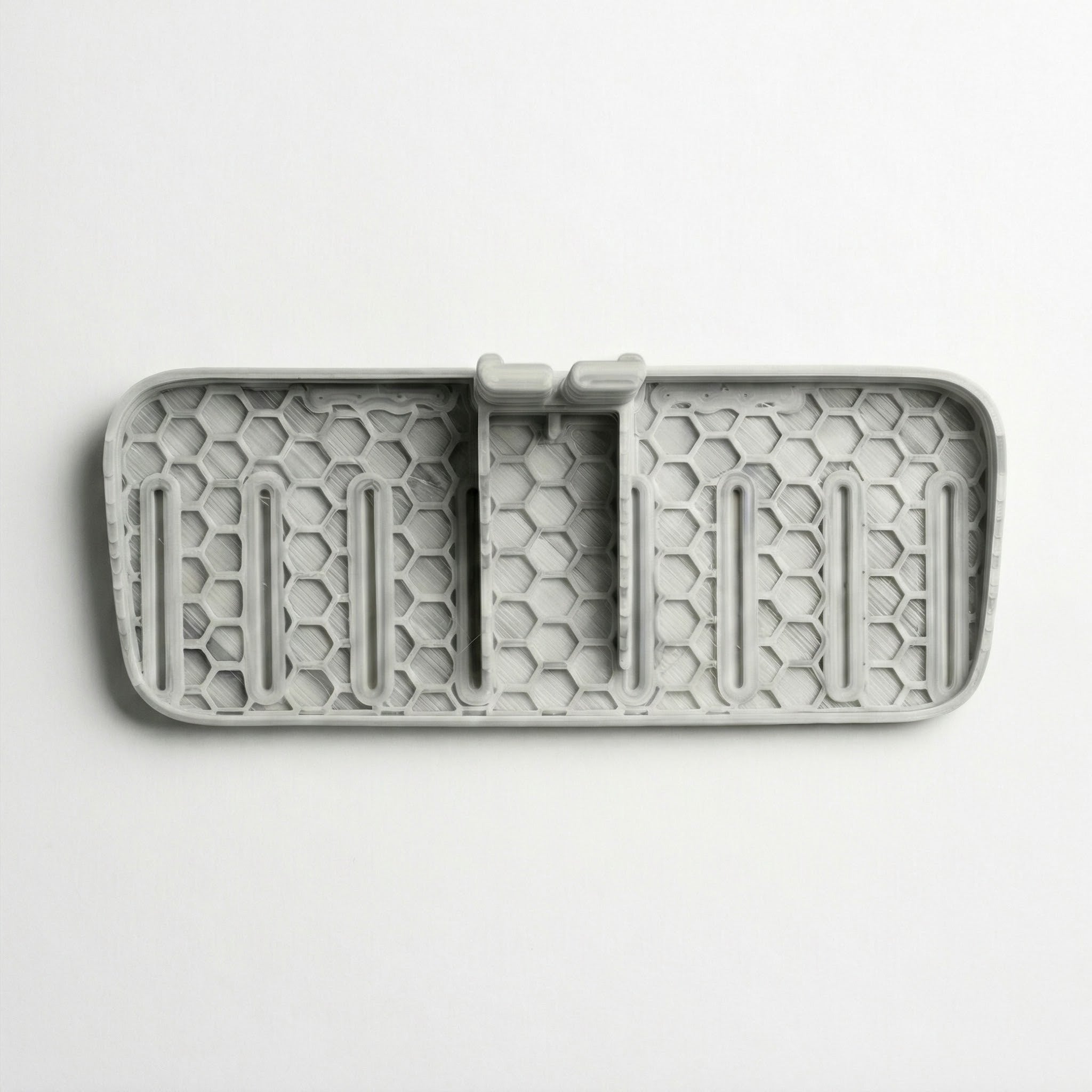 Gray Testa Seat Floor Base & Footrest with honeycomb pattern on a white background